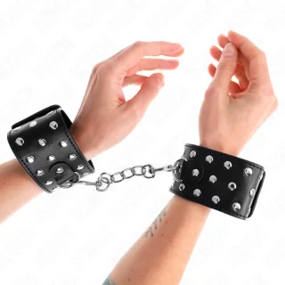 Fetisch-Toy KINK Handfesseln mit Nietenmuster und Kette Schwarz 24 cm